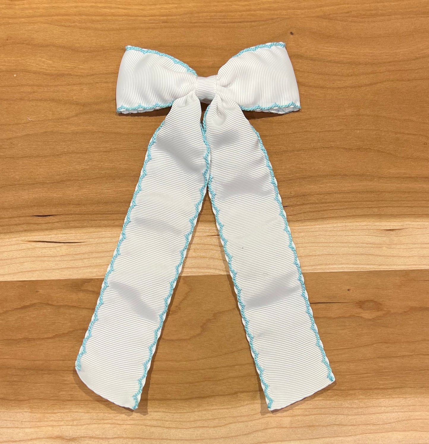 White grosgrain with Blue Moonstitch Long Tail Bow